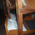 Small, cramped beds in the attic.