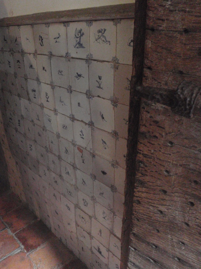 Rejected Delft tiles along the torture room's walls, used to make it easier to clean..